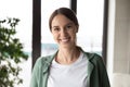 Head shot portrait smiling businesswoman looking at camera in office Royalty Free Stock Photo