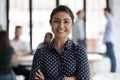 Head shot portrait smiling confident Indian businesswoman standing in office Royalty Free Stock Photo