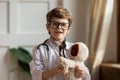 Head shot portrait smiling cute boy wearing uniform pretending doctor Royalty Free Stock Photo