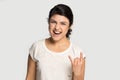 Head shot portrait smiling Indian girl showing cool rock gesture