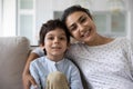 Head shot portrait smiling Indian mother with 5s son