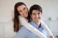 Head shot portrait smiling man piggy backing woman, enjoying weekend Royalty Free Stock Photo