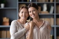 Head shot portrait smiling middle aged mother with adult daughter Royalty Free Stock Photo