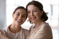 Head shot portrait smiling middle aged mother and grownup daughter Royalty Free Stock Photo