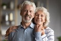 Head shot portrait smiling older man and woman hugging Royalty Free Stock Photo