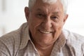 Head shot portrait smiling senior man looking at camera Royalty Free Stock Photo