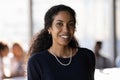 Head shot portrait smiling successful African American businesswoman in office Royalty Free Stock Photo