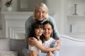 Head shot portrait smiling three generations of women at home Royalty Free Stock Photo