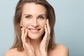 Head shot portrait smiling woman touching perfect smooth face skin Royalty Free Stock Photo