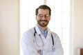 Head shot portrait smiling young man doctor wearing glasses Royalty Free Stock Photo