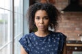 Head shot portrait of young serious african american woman.