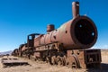 A head on shot a rusting steam trains and carriages that are slowly rot away at the train graveyard just outside of Uyuni, Royalty Free Stock Photo