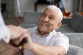 Smiling old male pensioner involved in rehabilitation procedure.