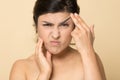 Head shot stressed Indian woman touching face, worried about wrinkle Royalty Free Stock Photo