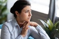 Head shot unhappy thoughtful Indian woman thinking about problems Royalty Free Stock Photo