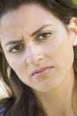 Head shot of woman scowling Royalty Free Stock Photo