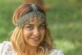 Boho chic. Beautiful woman wearing vintage headpiece.