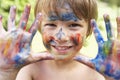 Head And Shoulders Portrait Of Boy With Painted Face and Hands Royalty Free Stock Photo