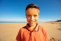 Head and shoulders portrait of boy smile on beach Royalty Free Stock Photo