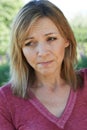 Head And Shoulders Portrait Of Concerned Mature Woman