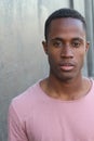 Head and shoulders portrait of a handsome African American man on a blue background Royalty Free Stock Photo