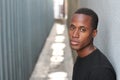 Head and shoulders portrait of a handsome African American man on urban background outdoors with copy space Royalty Free Stock Photo