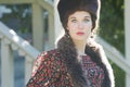 Head and shoulders portrait of Russian beautiful woman wearing fur Cossack hat and fur collar Royalty Free Stock Photo