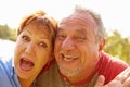 Head and Shoulders Portrait Of Senior Couple In Garden Royalty Free Stock Photo