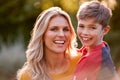 Head And Shoulders Portrait Of Smiling Mother And Son Hugging Outdoors Royalty Free Stock Photo