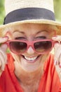 Head And Shoulders Portrait Of Smiling Senior Woman Wearing Sunglasses Royalty Free Stock Photo