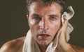 Head and shoulders portrait of young attractive and handsome sport man sweating after gym workout training hard tired and Royalty Free Stock Photo