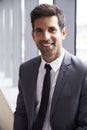 Head And Shoulders Portrait Of Young Businessman In Office Royalty Free Stock Photo