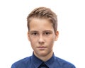 Head and shoulders portrait of a young 11 year old boy with brown eyes and dark hair in a good mood with a smile Royalty Free Stock Photo