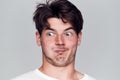 Head And Shoulders Studio Shot Of Man Pulling Faces And Smiling At Camera Royalty Free Stock Photo