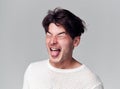 Head And Shoulders Studio Shot Of Man Pulling Faces And Smiling At Camera Royalty Free Stock Photo