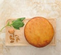 Head of smoked Suluguni cheese on wooden Board Royalty Free Stock Photo