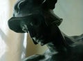 : Head of statue of Eros close up.