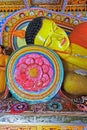 he head of the statue of Reclining Lord Buddha in Pamunuwa Buddhist Temple with bright lotus flower