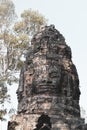 Faces on Temple in Angkor Thom, Khmer Temple, Siem Reap, Cambodia. Old style sphoto Royalty Free Stock Photo