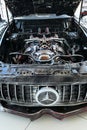 Head of transformer in replica of grand tourer car Mercedes AMG GT R made from scrap metal