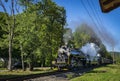 Head on View of a Double Header Steam Passenger Train, Blowing Smoke and Steam as it Approaches