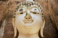 Head of the White Buddha statue in Wat Sri Chum temple in Sukhothai Historical park in Sukhothai, Thailand. Royalty Free Stock Photo