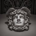 Head with wreath detail of the ancient sculpture