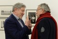 Head of the Yabloko party Grigory Yavlinsky and photojournalist Yuri Rost at a photo exhibition