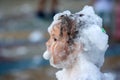 head of a young child covered with soap foam