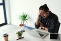 This headache is just making matters worse. a handsome young businessman looking stressed out and suffering from a Royalty Free Stock Photo