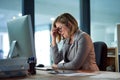 Headache, stress and business woman in office, tired or fatigue while working late at night on computer. Burnout Royalty Free Stock Photo