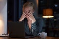Headache, stress and woman on laptop at night project deadline, mental health risk and anxiety problem. Sad, depression Royalty Free Stock Photo