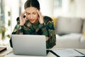 Headache, stress or woman soldier with trauma and depression at desk with anxiety on laptop. Frustrated, psychology or