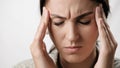 Headache. Suffering woman on white background holds her head with her hands. Stress, fatigue, migraine, high or low Royalty Free Stock Photo